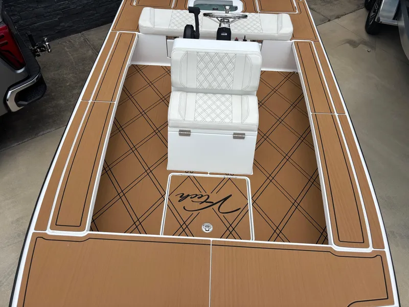 Slide: The Image of 2024 Vtech 18 FLATS boat with tan deck and white seating. - 12