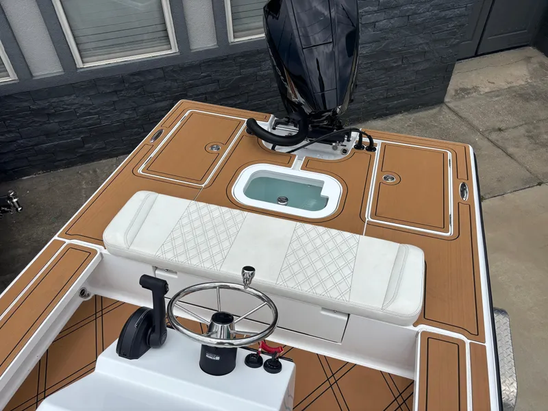 Slide: The Image of 2024 Vtech 18 FLATS boat with sleek deck design and modern steering console. - 14