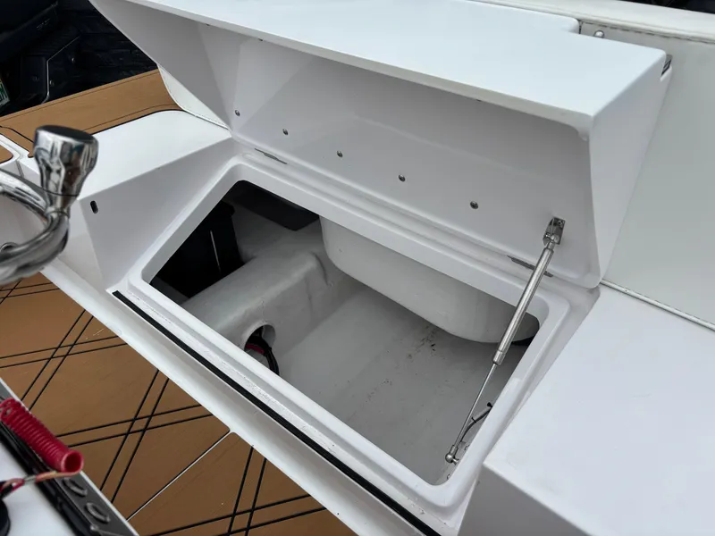 Slide: The Image of Open storage compartment on a 2024 Vtech 18 FLATS boat, showcasing interior space. - 19
