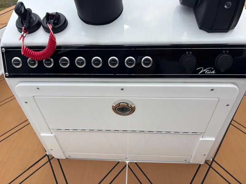 Slide: The Image of 2024 Vtech 18 FLATS control panel with buttons and dials on a white surface. - 23