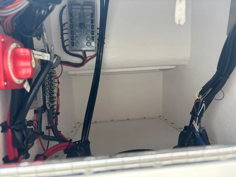 Slide: The Image of Electrical compartment of Vtech 18 FLATS 2024 with wiring and control panel. - 27