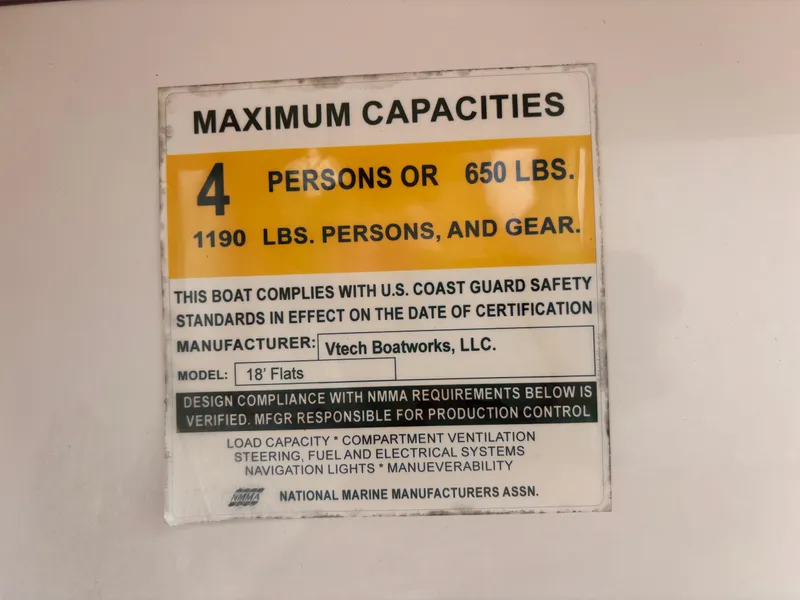 Slide: The Image of Maximum capacity label for Vtech 18 FLATS boat, 2024 model, showing weight and person limits. - 30