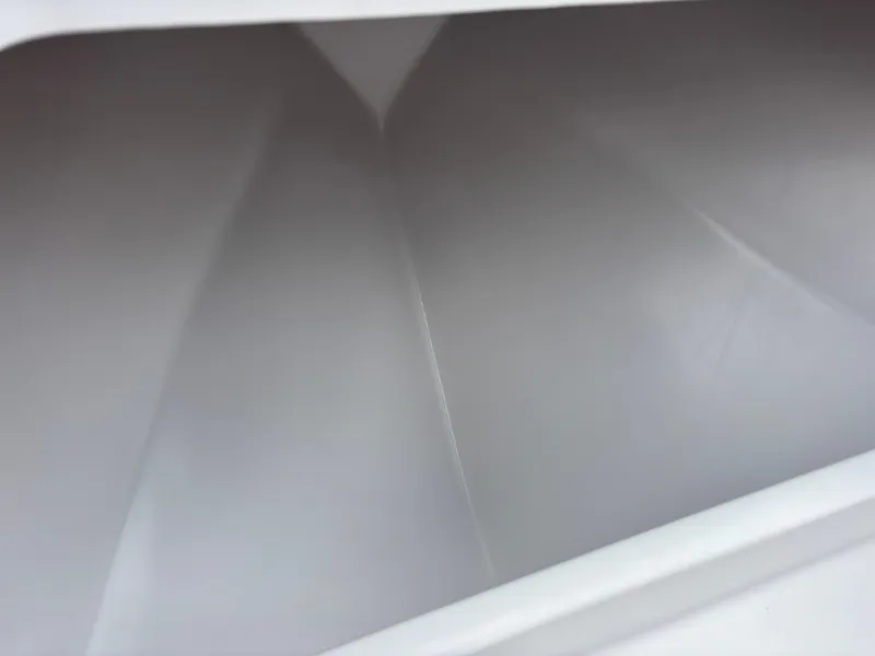 Slide: The Image of Empty interior of Vtech 18 FLATS, 2024 model, showcasing sleek white design. - 34