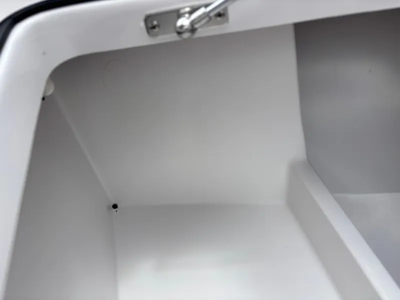 Slide: The Image of 2024 Vtech 18 FLATS storage compartment, white interior, open lid, metal latch. - 37