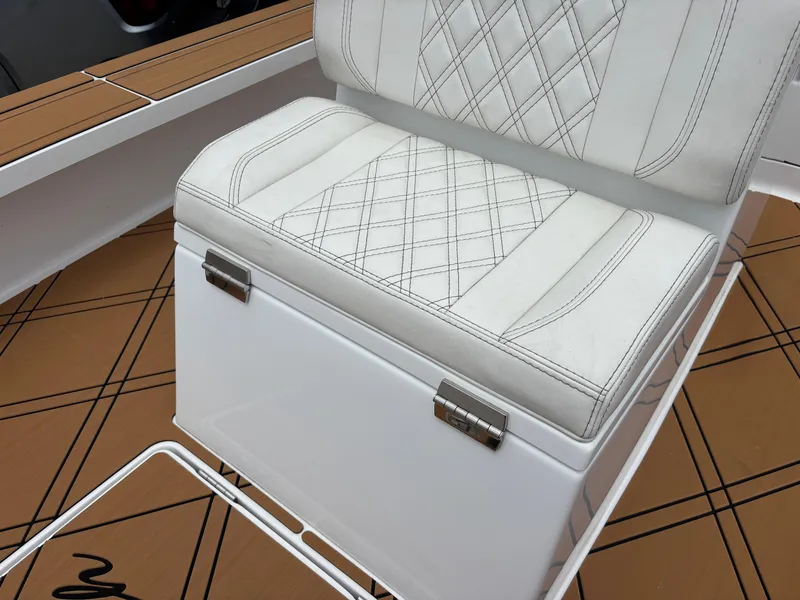 Slide: The Image of White cushioned seat with diamond stitching on a Vtech 18 FLATS 2024 boat. - 42