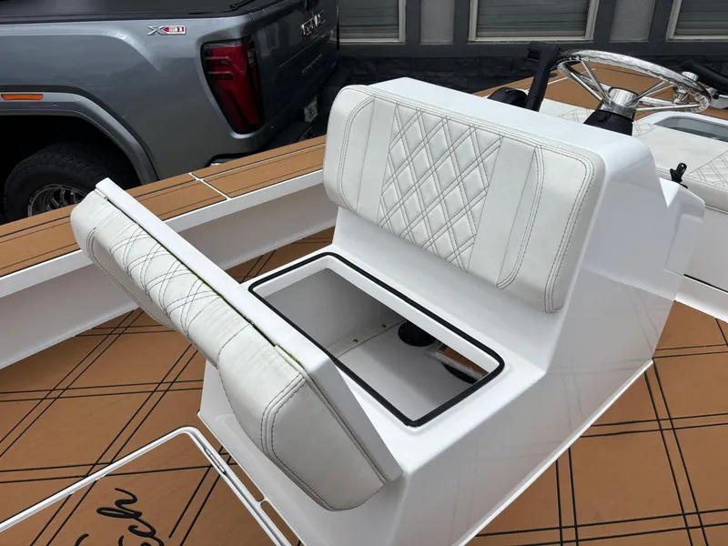 Slide: The Image of 2024 Vtech 18 FLATS boat seat with storage compartment, featuring diamond-stitched white upholstery. - 47