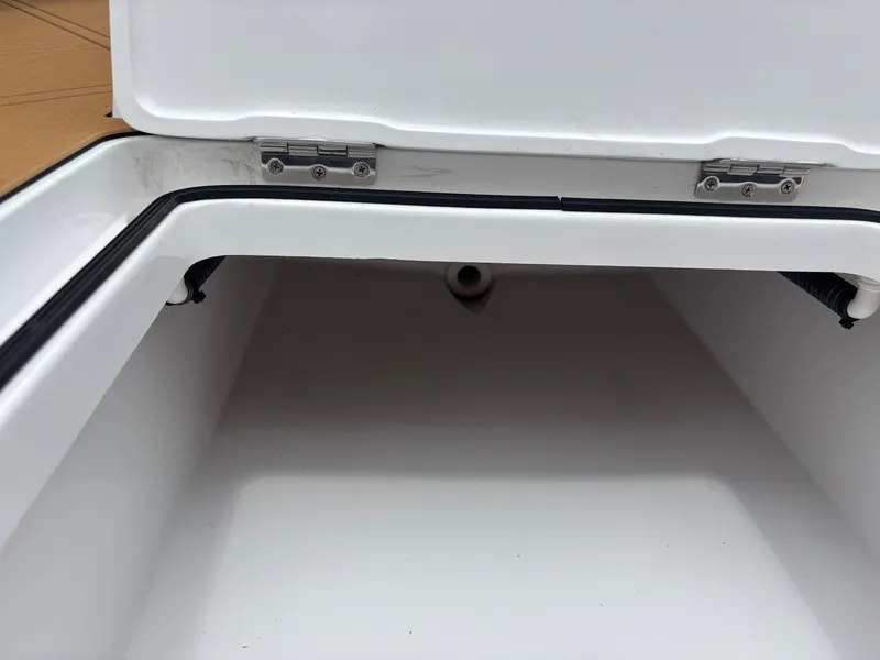 Slide: The Image of Open storage compartment of 2024 Vtech 18 FLATS boat, showing interior space. - 49