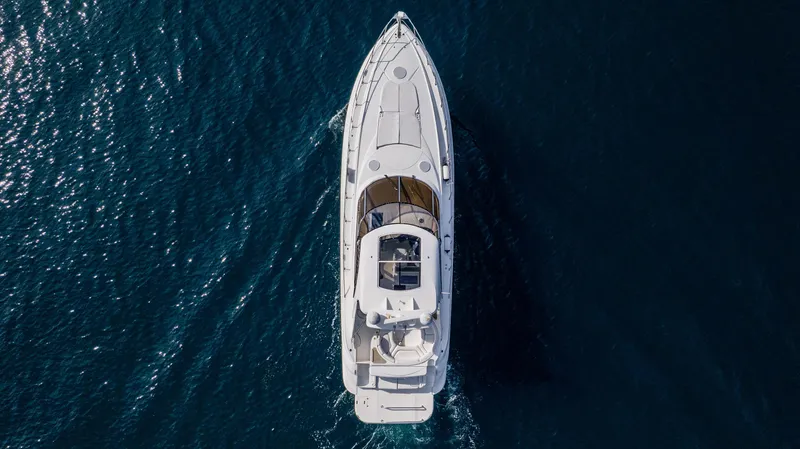 Slide: The Image of Aerial view of 2002 Cruisers Yachts 5370 Express on open water. - 2