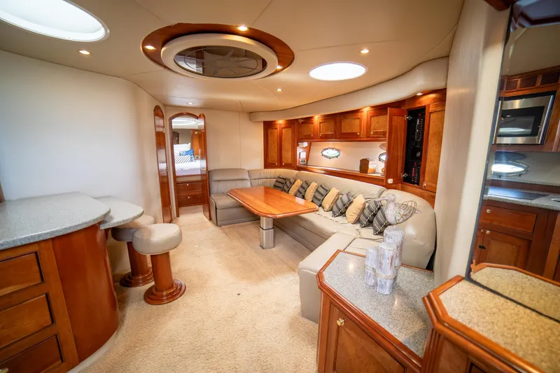 Slide: The Image of Luxurious interior of 2002 Cruisers Yachts 5370 Express with elegant wood finishes. - 24