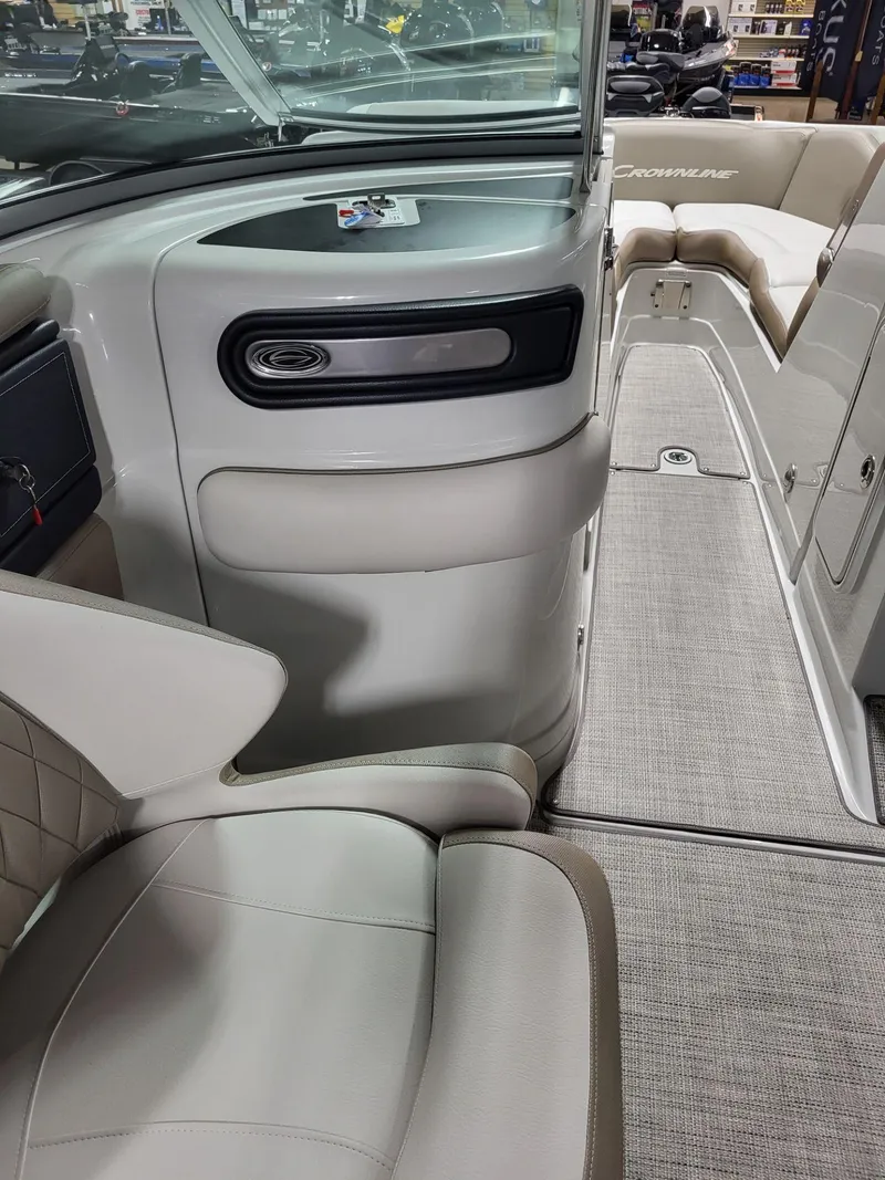 Slide: The Image of 2023 Crownline 260 SS boat interior with sleek seating and modern design. - 15