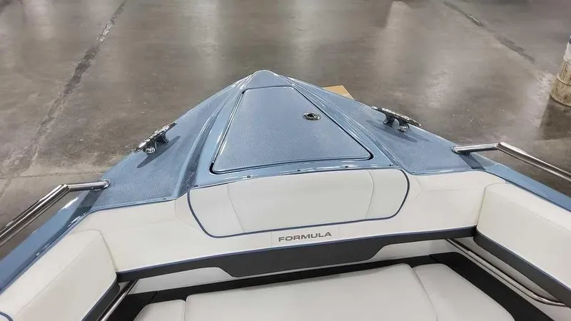 Slide: The Image of 2025 Formula 330 Crossover Bowrider boat interior with sleek design and comfortable seating. - 14