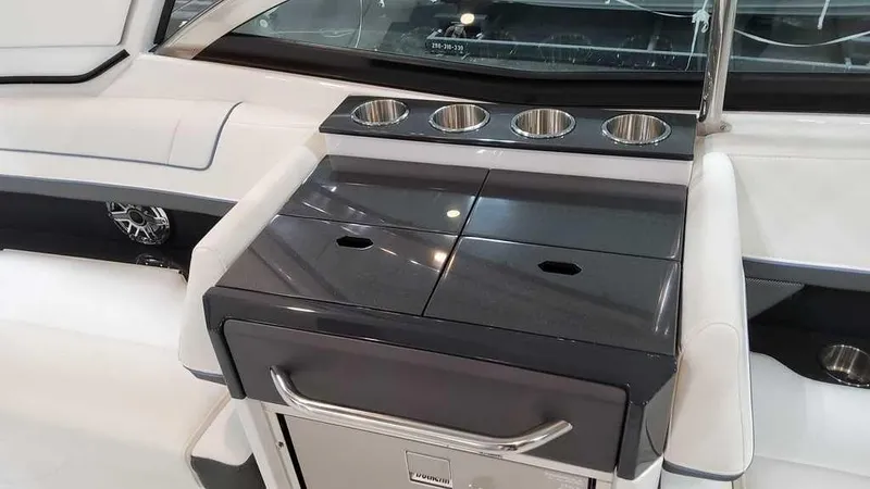 Slide: The Image of 2025 Formula 330 Crossover Bowrider interior with sleek countertop and cup holders. - 17