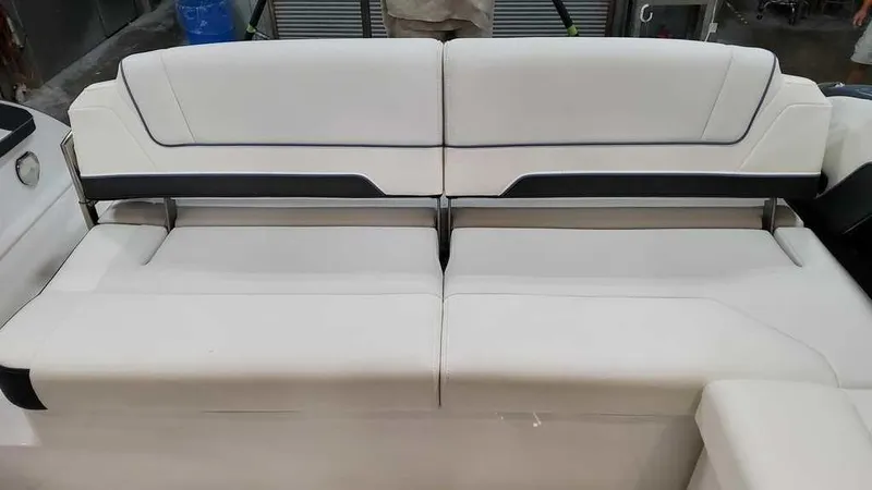 Slide: The Image of 2025 Formula 330 Crossover Bowrider interior seating, featuring sleek white upholstery. - 20
