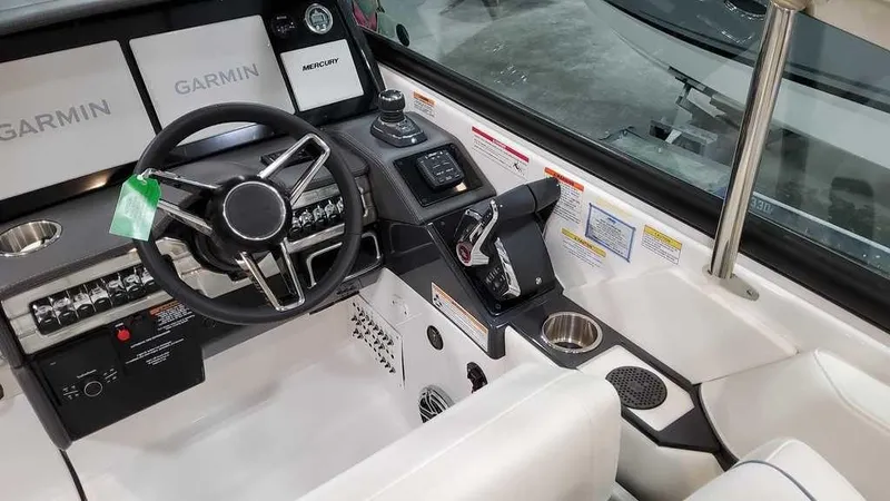 Slide: The Image of 2025 Formula 330 Crossover Bowrider cockpit with Garmin navigation and modern controls. - 23