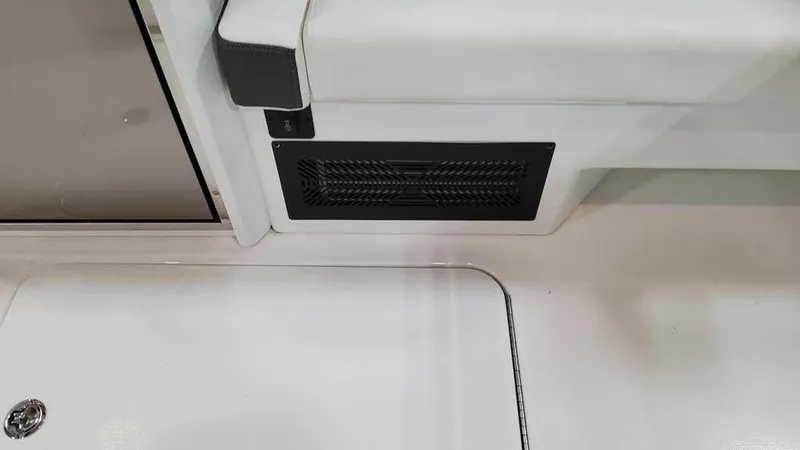 Slide: The Image of 2025 Formula 330 Crossover Bowrider interior detail with vent and seating area. - 24