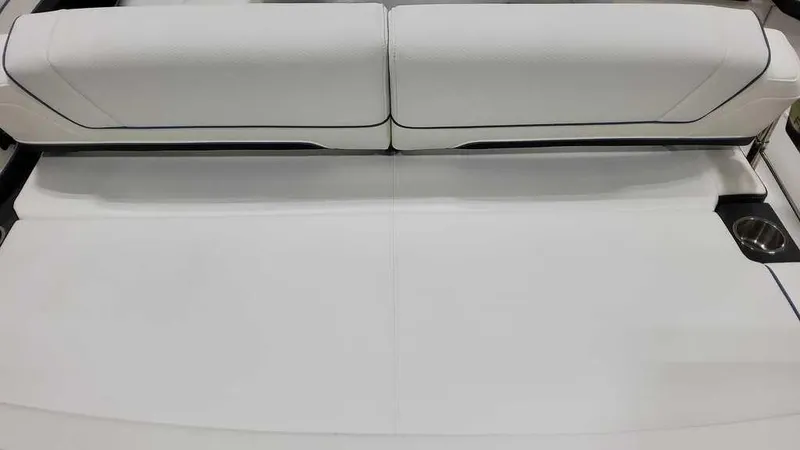 Slide: The Image of 2025 Formula 330 Crossover Bowrider interior with white seating and cup holders. - 39