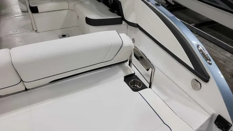 Slide: The Image of 2025 Formula 330 Crossover Bowrider interior with white seating and cup holder. - 40