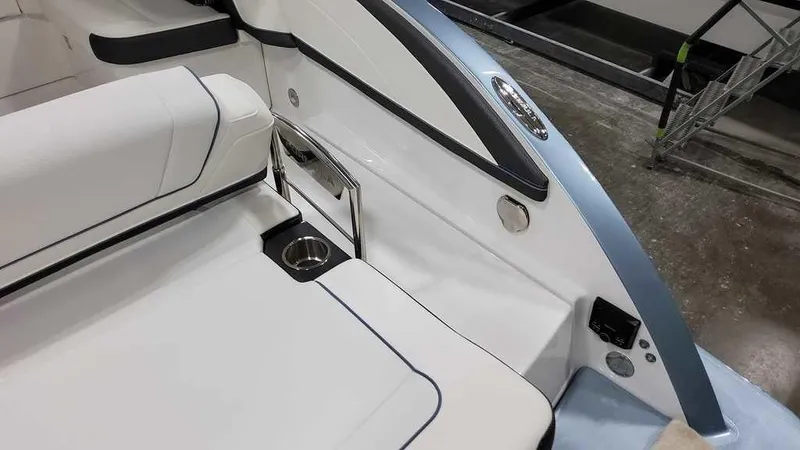Slide: The Image of 2025 Formula 330 Crossover Bowrider interior with sleek seating and cup holder. - 41
