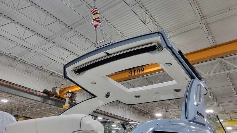 Slide: The Image of 2025 Formula 330 Crossover Bowrider in a factory setting, showcasing its sleek design. - 6