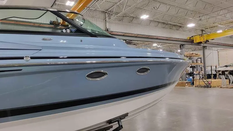 Slide: The Image of 2025 Formula 330 Crossover Bowrider in a warehouse setting. - 8