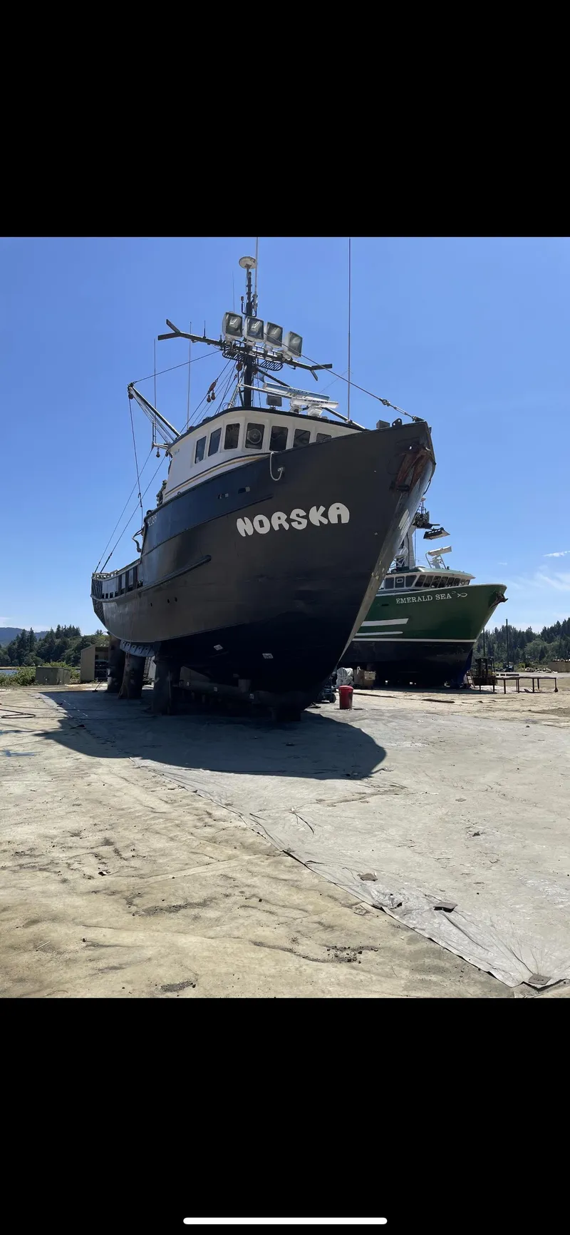 Slide: The Image of Custom 1980 fishing vessel on dry dock under clear blue sky. - 3