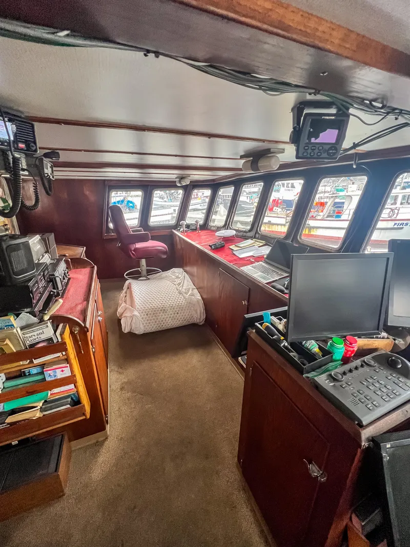 Slide: The Image of Interior of a 1980 custom fishing vessel with navigation equipment and seating. - 4