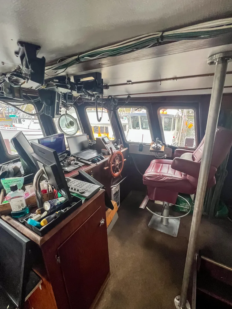 Slide: The Image of Interior of a 1980 custom fishing vessel with navigation equipment and captain's chair. - 5
