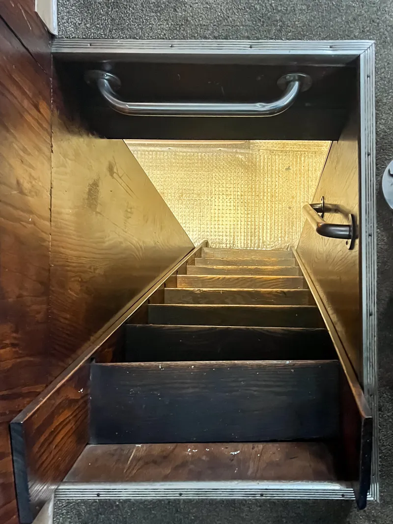 Slide: The Image of Narrow wooden staircase on a 1980 custom fishing vessel, viewed from above. - 7