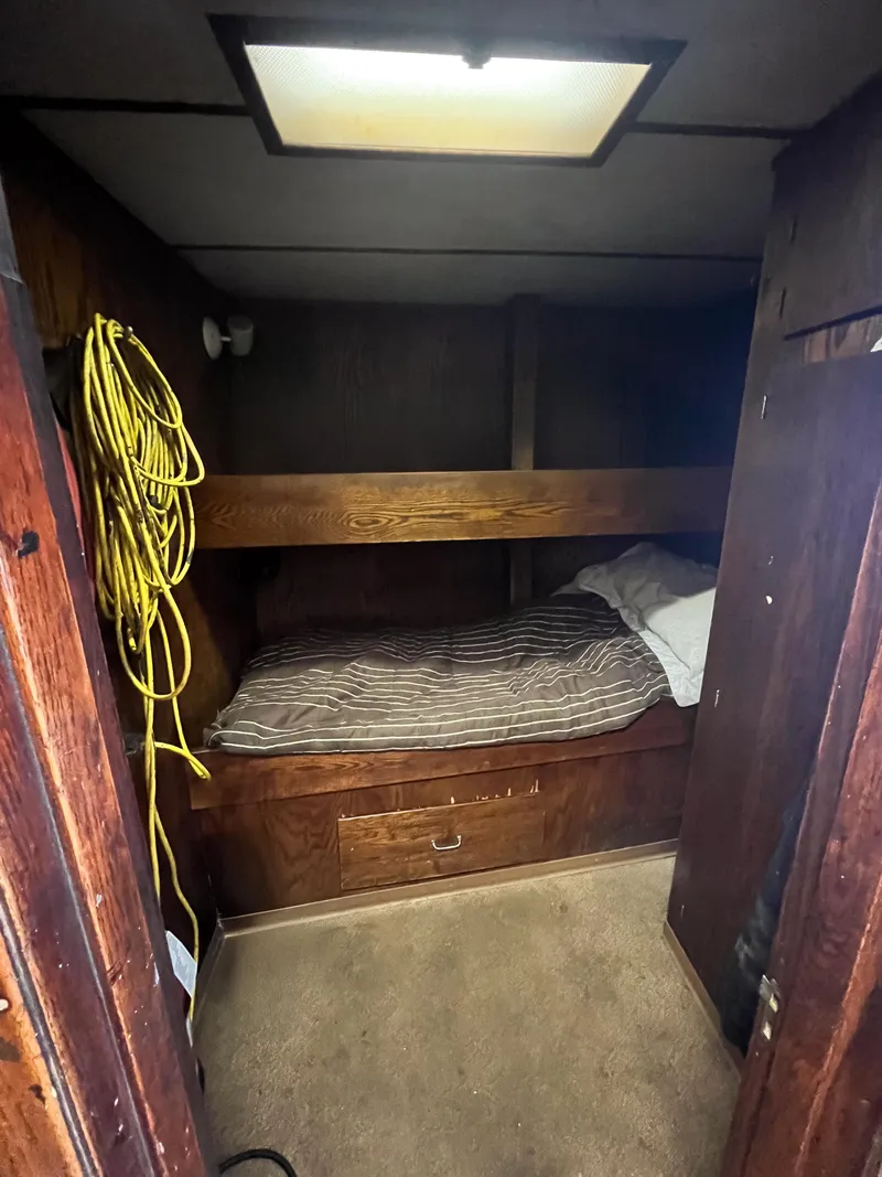 Slide: The Image of Cozy cabin interior of a 1980 custom fishing vessel with bunk bed and storage. - 8