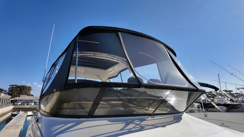 Slide: The Image of 2018 Sea Ray Fly 510 yacht with sleek design at marina. - 20