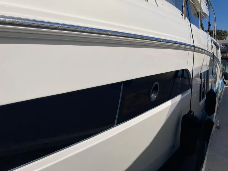 Slide: The Image of Close-up of 2018 Sea Ray Fly 510 yacht exterior, showcasing sleek design and detailing. - 30