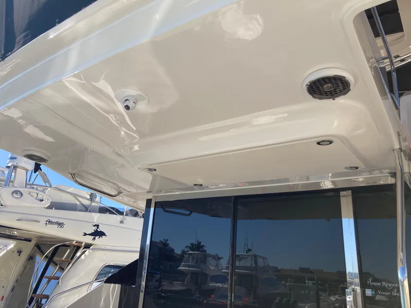 Slide: The Image of 2018 Sea Ray Fly 510 yacht with sleek exterior and modern design features. - 32