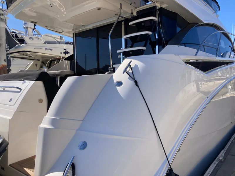 Slide: The Image of 2018 Sea Ray Fly 510 yacht with sleek design and modern features. - 33