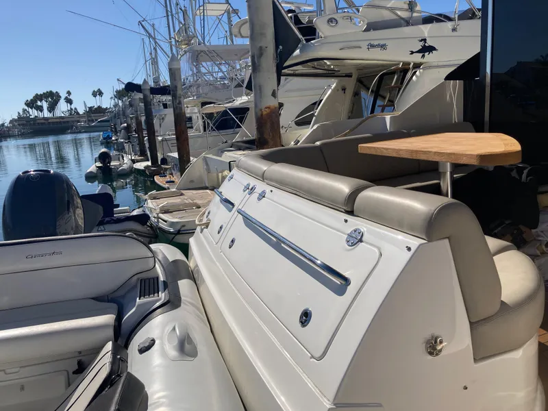 Slide: The Image of 2018 Sea Ray Fly 510 yacht docked at marina, featuring sleek design and luxurious seating. - 34