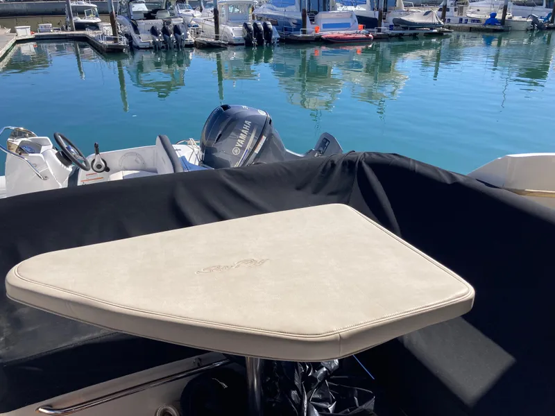 Slide: The Image of 2018 Sea Ray Fly 510 yacht with table, docked in marina. - 40