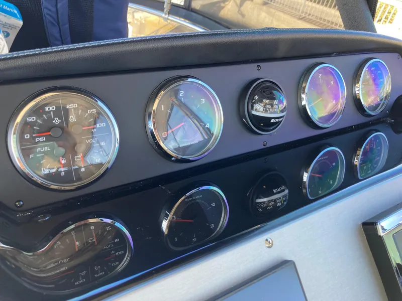 Slide: The Image of Dashboard of 2018 Sea Ray Fly 510 with various gauges and controls. - 50