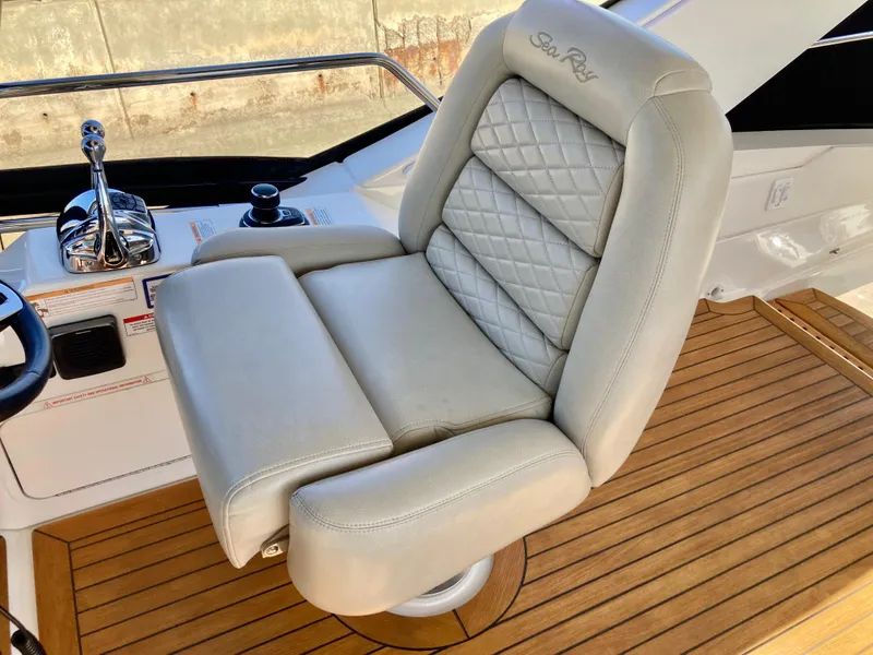 Slide: The Image of Luxurious captain's chair on 2018 Sea Ray Fly 510 yacht, featuring elegant design and comfort. - 52