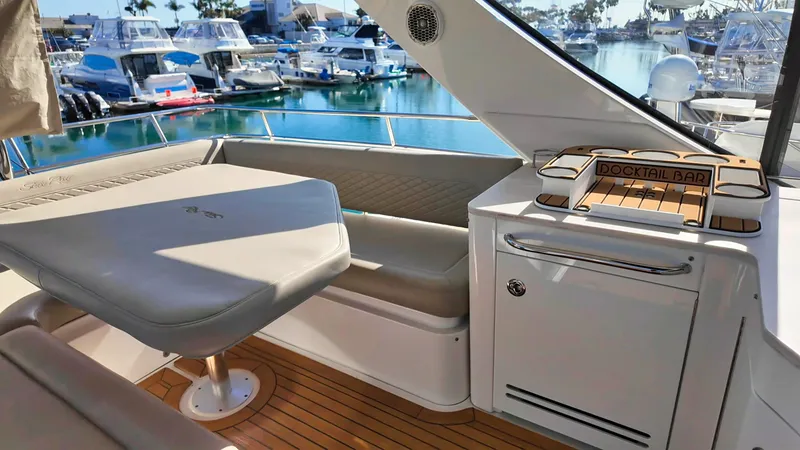 Slide: The Image of Luxurious 2018 Sea Ray Fly 510 yacht interior with seating and cocktail bar. - 55