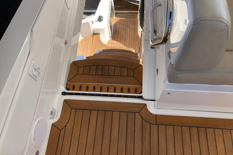 Slide: The Image of 2018 Sea Ray Fly 510 yacht interior with teak flooring and seating. - 66