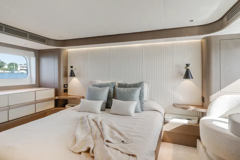 Slide: The Image of Luxurious bedroom interior of 2023 Azimut Magellano 66 yacht, featuring modern design and elegant furnishings. - 26