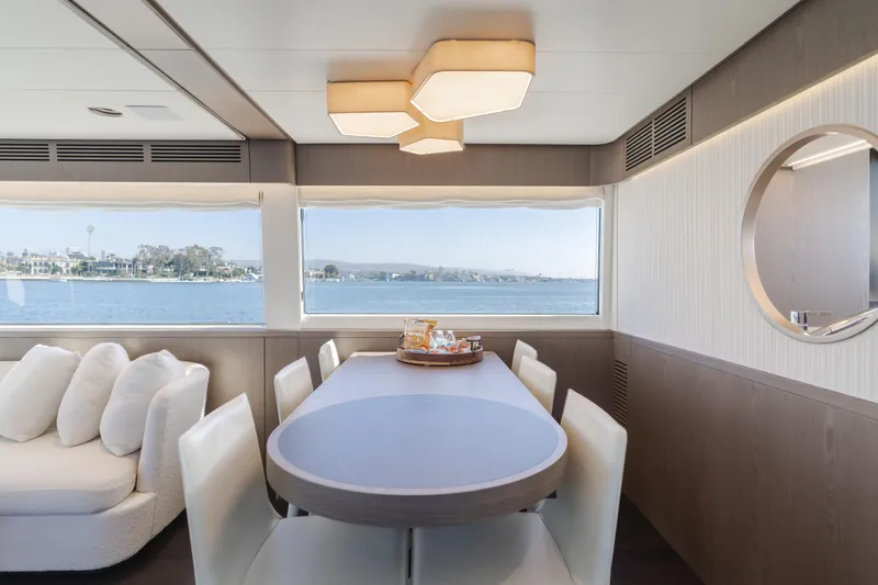 Slide: The Image of Luxurious dining area on 2023 Azimut Magellano 66 yacht with scenic ocean view. - 41