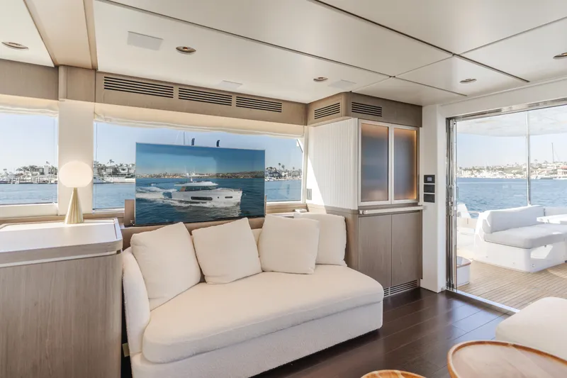 Slide: The Image of Luxurious interior of 2023 Azimut Magellano 66 yacht with elegant seating and ocean view. - 42