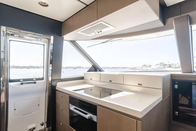 Slide: The Image of Modern kitchen interior of 2023 Azimut Magellano 66 yacht with sleek design and ocean view. - 44