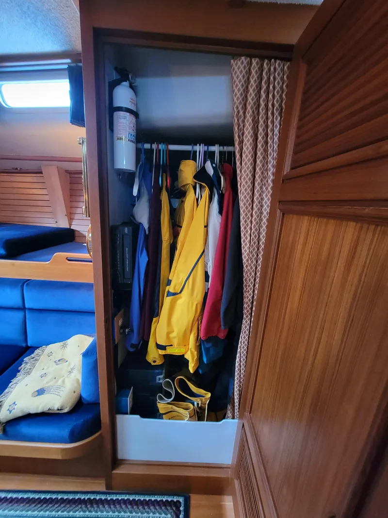 Slide: The Image of Sailboat interior closet with jackets and gear, Fuji 40, 1978 model. - 33