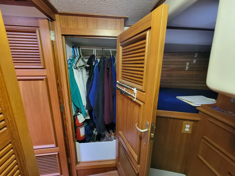 Slide: The Image of Wooden closet and cabin interior on a 1978 Fuji 40 sailboat. - 42