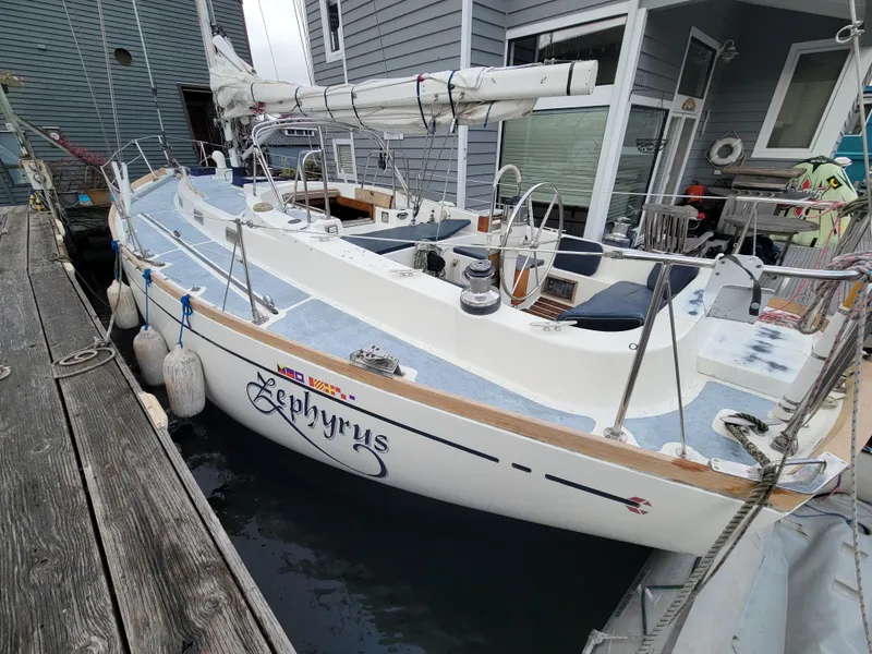 Slide: The Image of 1978 Fuji 40 sailboat named Zephyrus docked at a marina. - 6