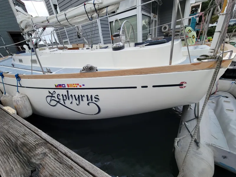 Slide: The Image of Sailboat "Zephyrus" docked, Fuji 40 model, 1978, with nautical flags. - 7