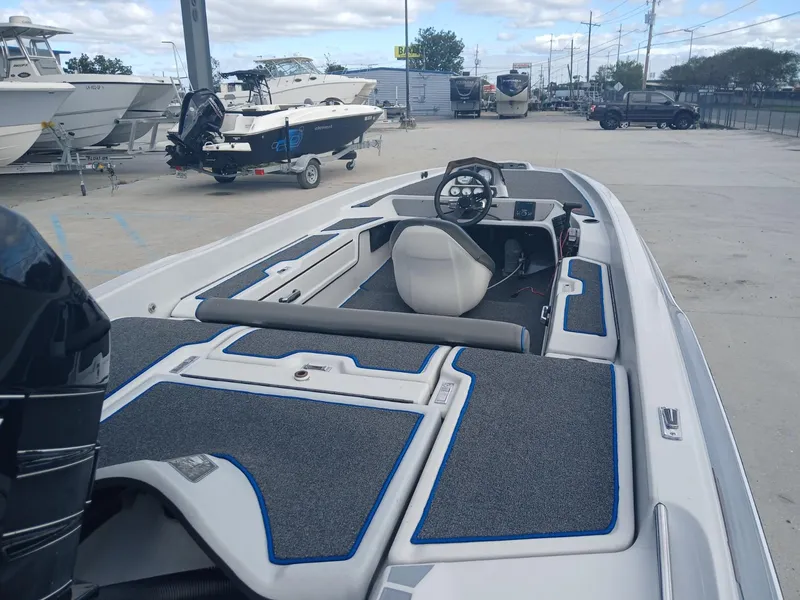 Slide: The Image of Allison 2002 XB boat, 1988 model, parked with other boats in a marina. - 15