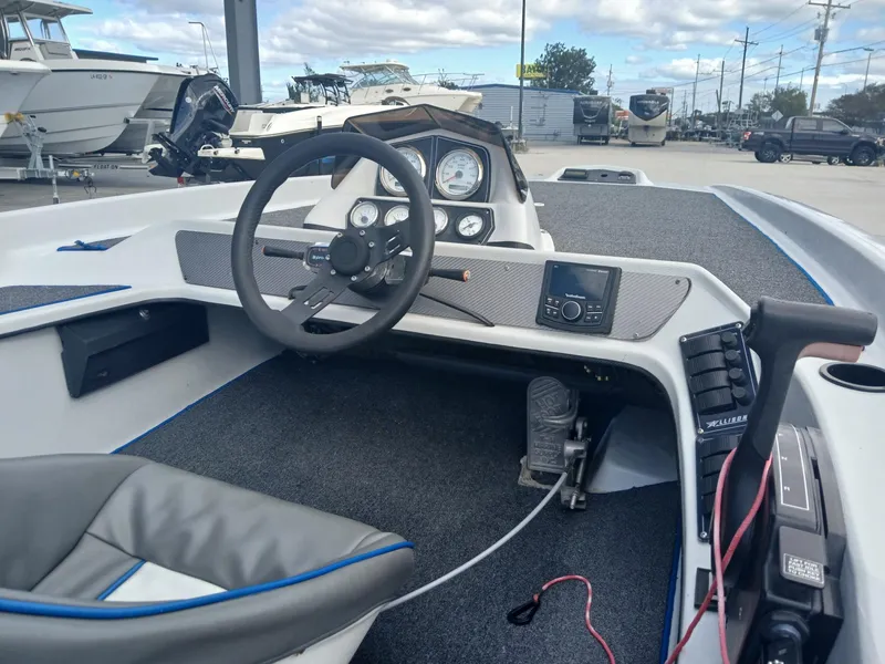 Slide: The Image of Interior of 1988 Allison 2002 XB boat with steering wheel and dashboard controls. - 5