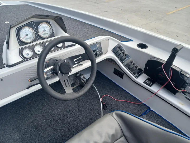 Slide: The Image of Allison 2002 XB boat dashboard with steering wheel and control panel, 1988 model. - 8